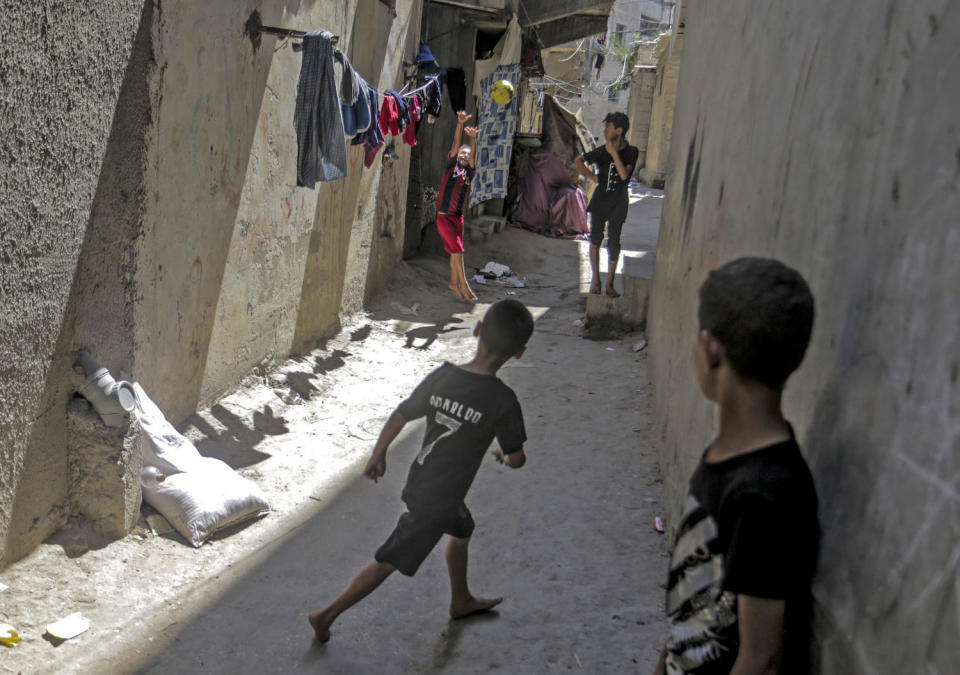 Palestinian children play outside their home in the Al-Shati refugee camp in the Gaza Strip in August 2023. (Mahmoud Issa / Sipa USA via AP file)