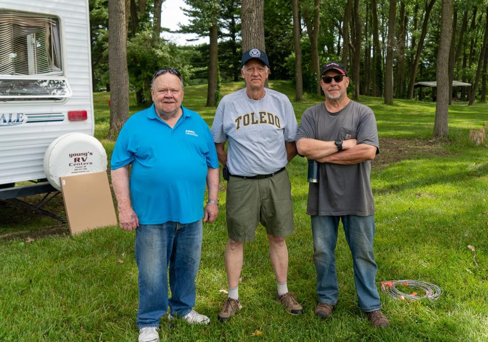 Paul Trouten, Wes Busdiecker, and Jeff Giles attend the annual Field Day hosted by the Monroe County Radio Communications Association at Vienna Park.