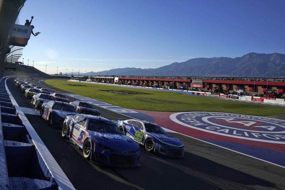 Kyle Larson leads the field under caution during last year's NASCAR Cup race at Auto Club Speedway.