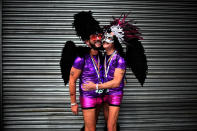 <p>A gay couple embrace as they watch the Belfast Gay Pride march taking place on August 5, 2017 in Belfast, Northern Ireland. (Photo: Charles McQuillan/Getty Images) </p>