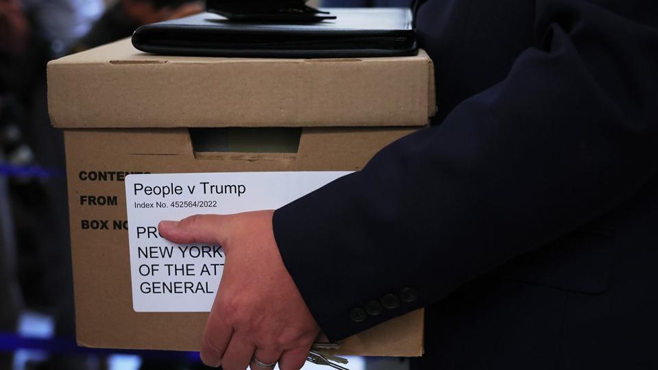 A box is carried as the civil fraud trial of former President Donald Trump is set to begin at New York State Supreme Court on October 02, 2023 in New York City. Former President Trump may be forced to sell off his properties after Justice Arthur Engoron canceled his business certificates after ruling that he committed fraud for years while building his real estate empire after being sued by Attorney General Letitia James, who is seeking $250 million in damages. The trial will determine how much he and his companies will be penalized for the fraud.