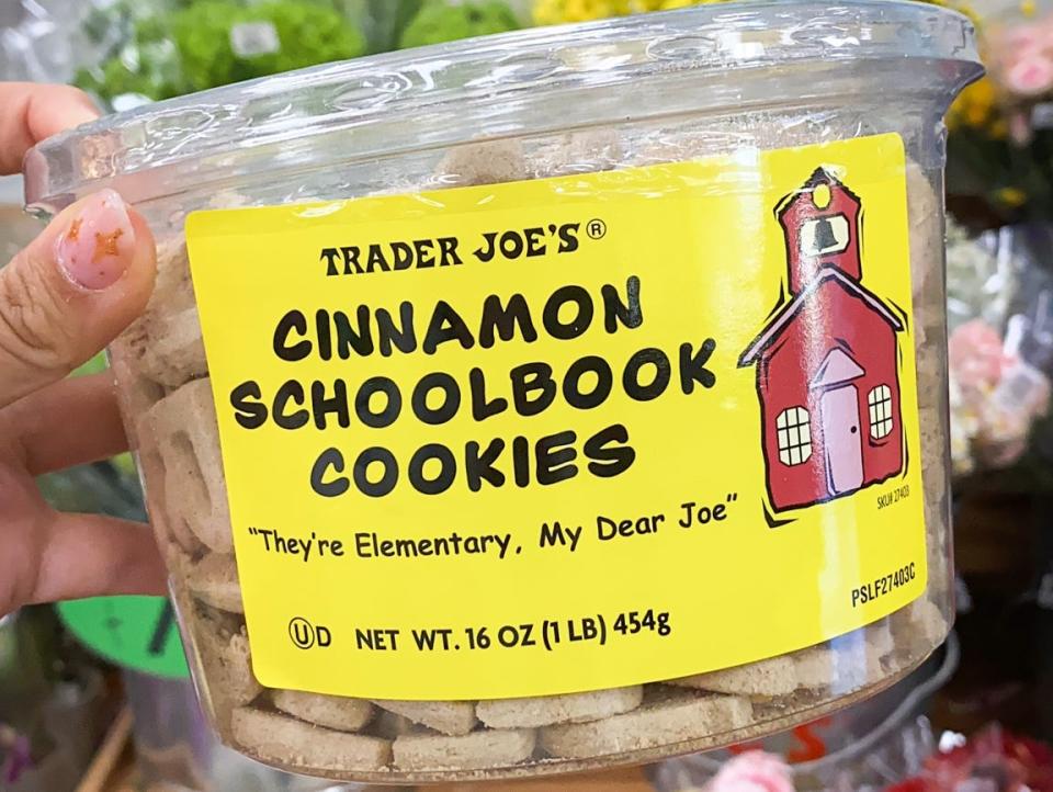 hand holding package of schoolbook cookies at trader joes