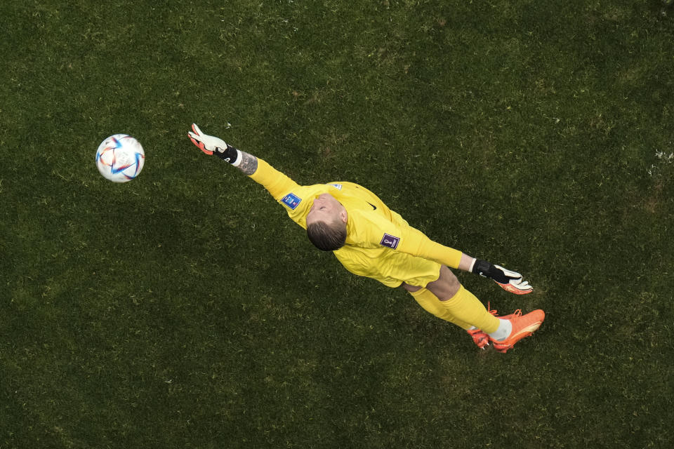England's goalkeeper Jordan Pickford clears the ball during the World Cup group B soccer match between England and The United States, at the Al Bayt Stadium in Al Khor, Qatar, Friday, Nov. 25, 2022. (AP Photo/Hassan Ammar)