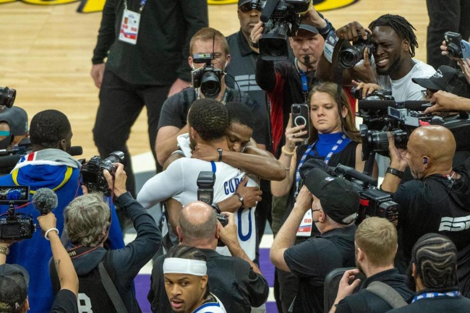 Kings guard De’Aaron Fox hugs Golden State Warriors guard Stephen Curry after the Warriors won Game 7 of the first-round NBA playoff series at Chase Center last year.