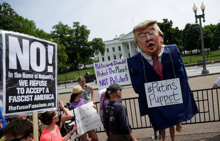A protester dressed as U.S. President Donald Trump rally during the Peoples Climate March at the White House in Washington, U.S., April 29, 2017. REUTERS/Joshua Roberts