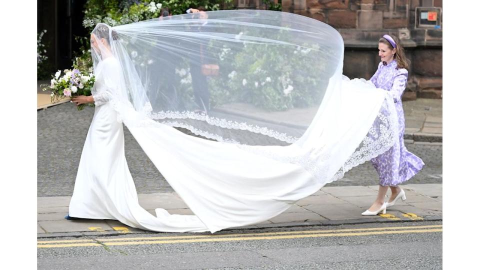 A photo of Olivia Henson walking into the Chester Cathedral