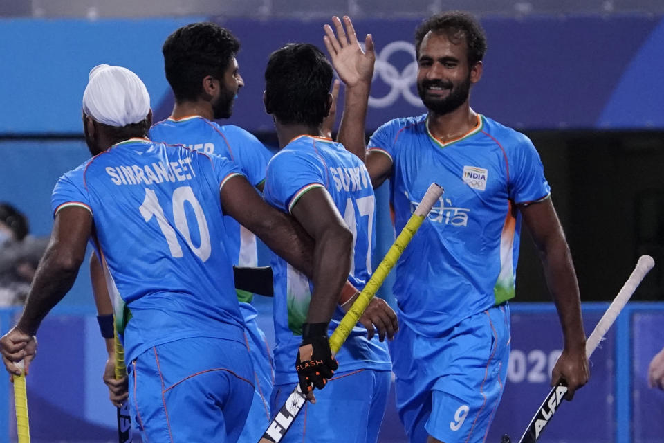 India's Gurjant Singh (9) celebrates after scoring against Japan during a men's field hockey match at the 2020 Summer Olympics, Friday, July 30, 2021, in Tokyo, Japan. (AP Photo/John Locher)