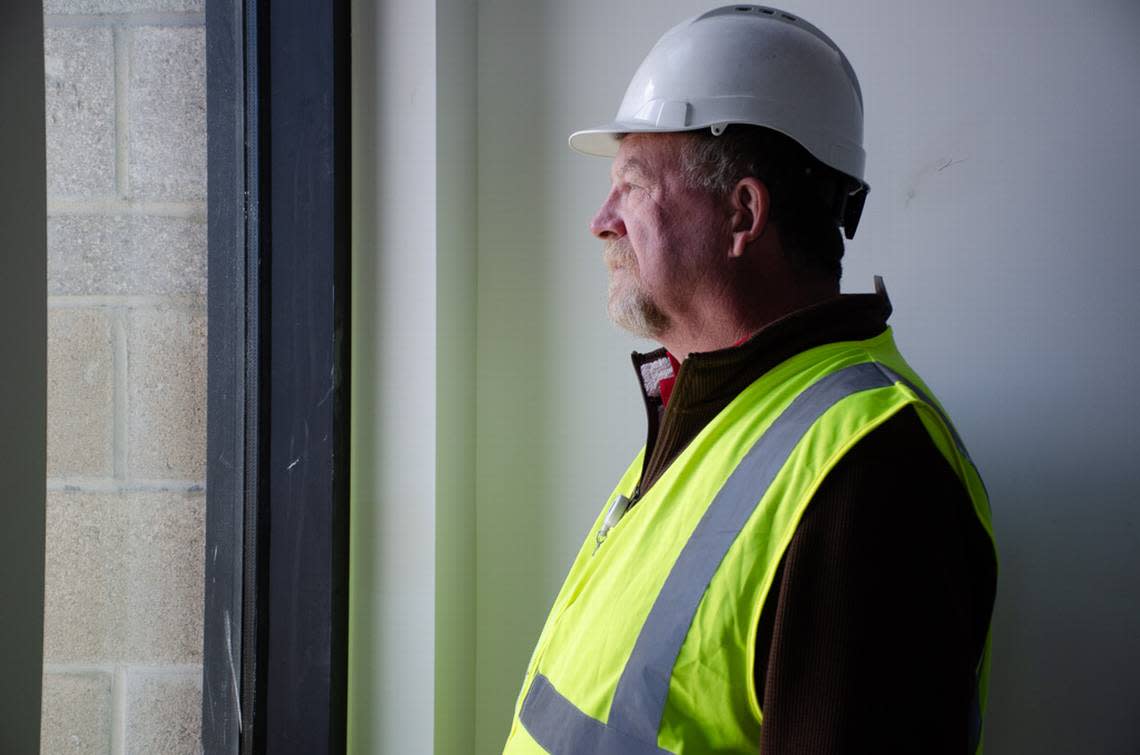 John Weatherby, Pasco School District’s constructions project manager, looks out a window Tuesday, May 7, 2024, during a tour of the Sageview High School construction site, located at 6091 Burns Road in Pasco, Washington.