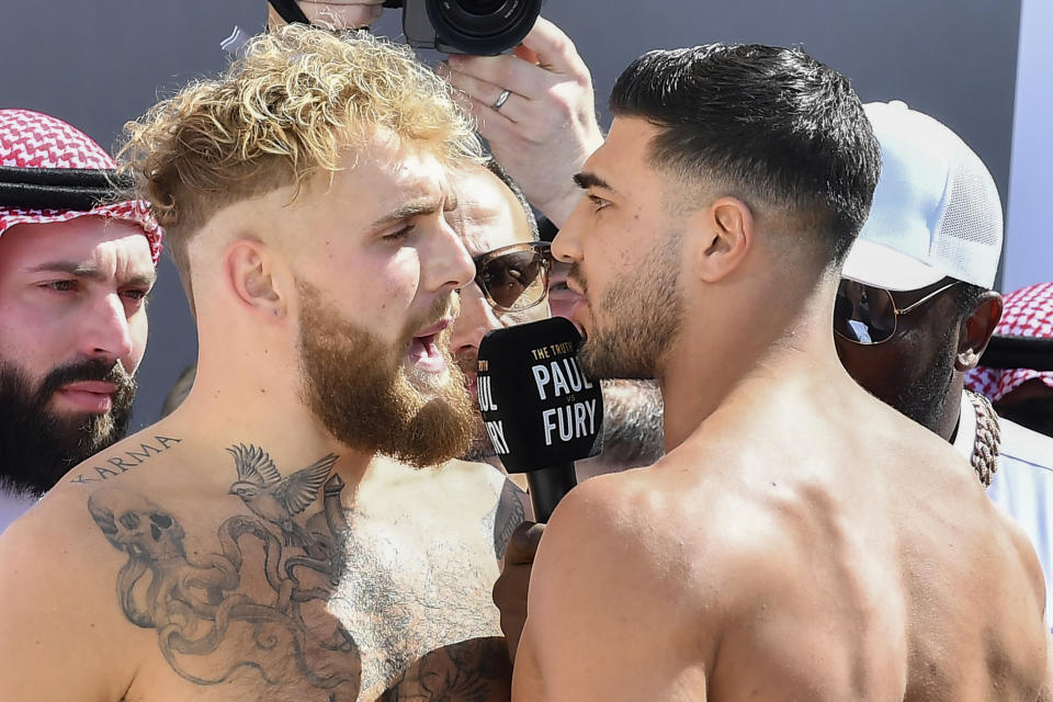 Jake Paul, left, and Tommy Fury, face off after a weigh-in, a day before their match, in Riyadh, Saudi Arabia, Saturday, Feb. 25, 2023. (AP Photo)