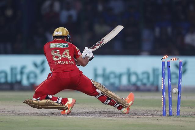Bails fly off the wicket of Punjab Kings' Prabhsimran Singh during the Indian Premier League cricket match between Delhi Capitals and Punjab Kings in New Delhi, India, Saturday, May 13, 2023. (AP Photo/Surjeet Yadav)