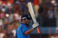 Cricket - India v England - Second One Day International - Barabati Stadium, Cuttack, India - 19/01/17. India's Mahendra Singh Dhoni celebrates after scoring a century. REUTERS/Adnan Abidi