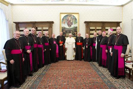 Pope Francis poses with Austrian bishops during a meeting at the Vatican January 30, 2014. REUTERS/Osservatore Romano