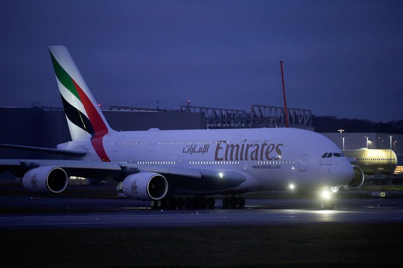 FILE PHOTO: An Airbus A380 takes off after Airbus makes its last ever delivery of an A380 to Emirates in Hamburg-Finkenwerder