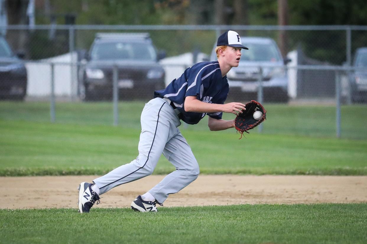 Framingham’s JJ Blanchard (25) looks to 1st base after fielding a ground ball during the second game of the Central Mass. Senior Babe Ruth finals against Marlborough in Framingham, Aug. 3, 2021.  