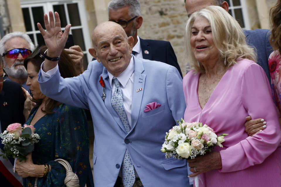 US WWII veteran Harold Terens, 100, left, and Jeanne Swerlin, 96, arrive to celebrate their wedding at the town hall of Carentan-les-Marais, in Normandy, northwestern France, on Saturday, June 8, 2024. Together, the collective age of the bride and groom was nearly 200. But Terens and his sweetheart Jeanne Swerlin proved that love is eternal as they tied the knot Saturday inland of the D-Day beaches in Normandy, France. (AP Photo/Jeremias Gonzalez)