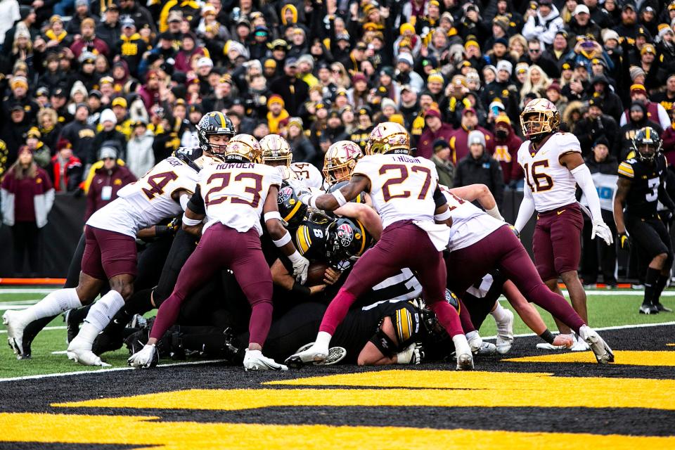 Iowa quarterback Alex Padilla (8) scores a touchdown during a NCAA Big Ten Conference football game against Minnesota, Saturday, Nov. 13, 2021, at Kinnick Stadium in Iowa City, Iowa.