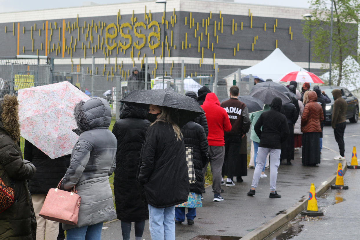 Thousands of people are queued Bolton on saturday. (SWNS) 