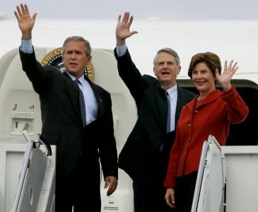 FILE PHOTO:  U.S. President George W. Bush waves from the steps of Air Force One alongside Democratic party Senator Zell Miller (D-Ga) and first lady Laura Bush as they arrive at a campaign election rally in Lititz, Pennsylvania, October 27, 2004. Bush is campaigning today in Pennsylvania, Ohio and Michigan during the final week of campaigning before the November 2 Presidential election. REUTERS/Jason Reed