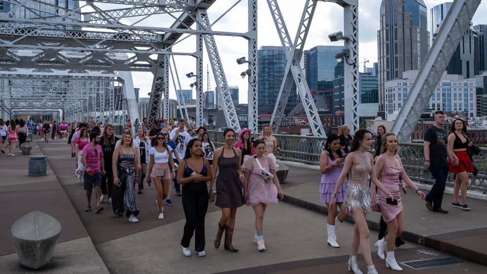 Fans make their way across the People's Bridge to Nissan Stadium ahead of Swift's performance on May 6, 2023. - Seth Herald/Getty Images