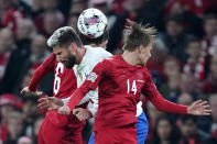 France's Olivier Giroud is challenged by Denmark's Andreas Christensen, left, and Mikkel Damsgaard during the UEFA Nations League soccer match between Denmark and France at Parken Stadium in Copenhagen, Denmark, Sunday Sept. 25, 2022. (Liselotte Sabroe/Ritzau Scanpix via AP)