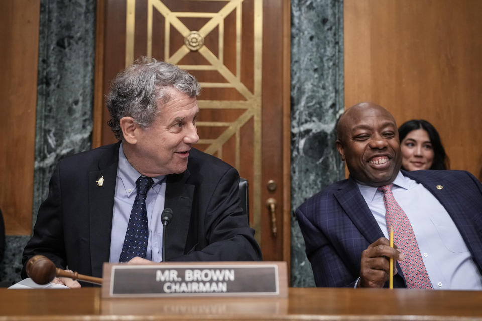 WASHINGTON, DC - SEPTEMBER 12: Committee chairman Sen. Sherrod Brown (D-OH) talks to ranking member Sen. Tim Scott (R-SC) as they arrive for a Senate Banking Committee hearing on Capitol Hill September 12, 2023 in Washington, DC. The hearing focused on oversight of the U.S. Securities and Exchange Commission. (Photo by Drew Angerer/Getty Images)