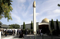 His Royal Highness Prince El Hassan bin Talal Hashemite of the Kingdom of Jordan and his entourage are escorted to the Al Noor mosque in Christchurch, New Zealand, Saturday, March 23, 2019. The mosque reopened today following the March 15 mass shooting. (AP Photo/Mark Baker)