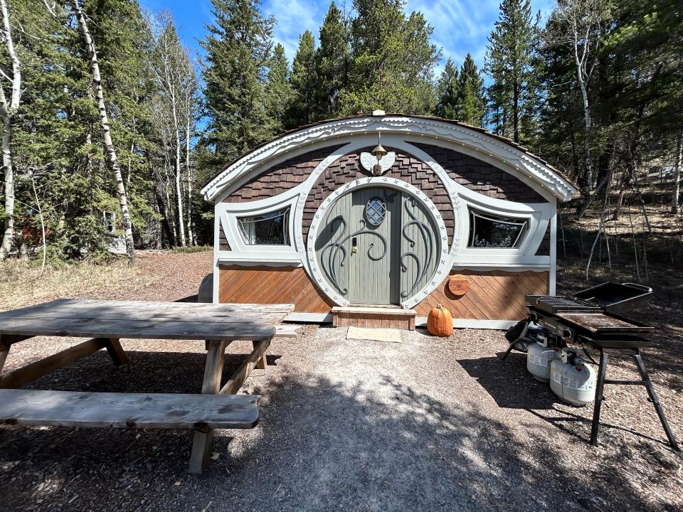 lia's cottage exterior with picnic table and grill