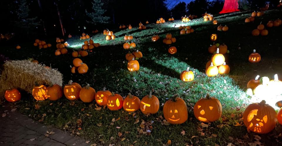 Pumpkins grin at visitors to the Kingwood Center Gardens' Great Pumpkin Glow in this file photo.