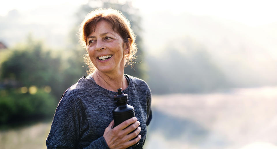 Happy woman exercising (Getty Images)