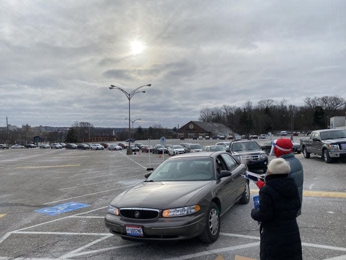 Drivers line up at Five Points on West Exchange Street in Akron for a free COVID-19 test distribution organized by Akron City Council.