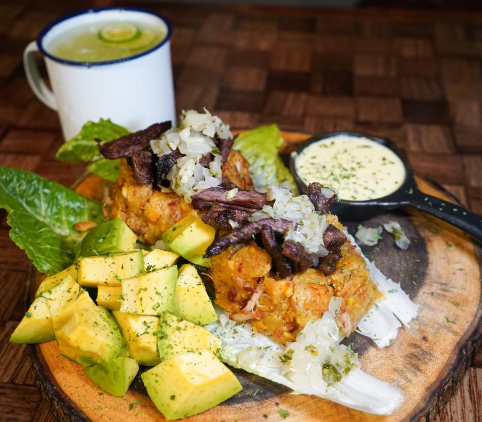 Mofongo topped with churrasco is one of the many dishes served over the earthy green plantain mash at La Casa del Mofongo in West Palm Beach.