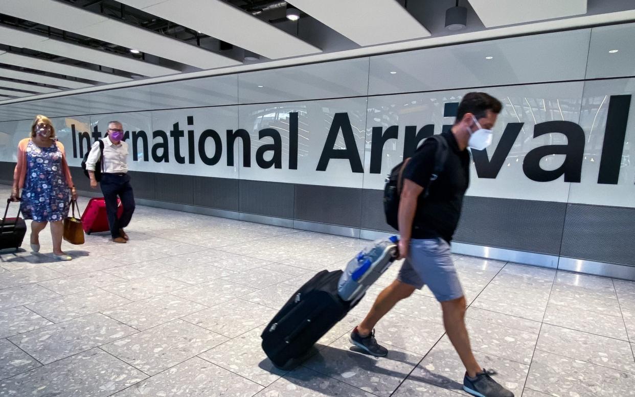 File photo dated 22/08/20 of passengers in the arrivals hall at Heathrow Airport, London. The UK should be a global leader in reopening international travel due to its "great progress" in tackling the coronavirus pandemic, according to the boss of British Airways. PA Photo. Issue date: Sunday March 14, 2021. Chief executive Sean Doyle urged the Government to "set an example" and "be ambitious" in developing systems which enable people to travel overseas. See PA story HEALTH Coronavirus Travel. - Aaron Chown/PA Wire