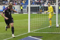 Bayern's Harry Kane celebrates after he scored his side's second goal during a German Bundesliga soccer match between SV Darmstadt 98 and Bayern Munich in Darmstadt, Germany, Saturday, March 16, 2024. (AP Photo/Michael Probst)