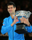 Djokovic poses with the Norman Brookes Trophy.