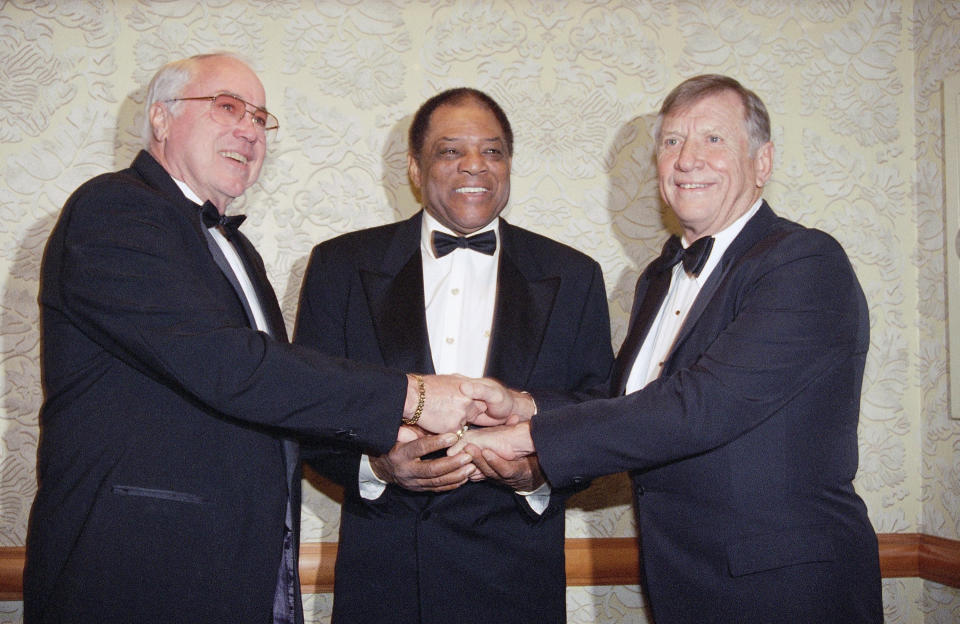 FILE - This Jan. 22, 1995, file photo shows from left, Duke Snider, Willie Mays and Mickey Mantle joining hands as they pose at the New York chapter dinner of the Baseball Writers Association, in New York. In 1979, Mays was the only player elected to the Hall of Fame by the baseball writers. Snider said at the time, “Willie more or less really deserves to be in by himself.” (AP Photo/Eric Miller, File)
