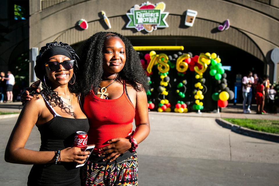 Angel McCambry, left, and Na'ilah Bakare pose for a photo during the "Downtown at Sundown" event hosted by the Johnson County Iowa Juneteenth Commemoration on June 17, 2022, in Iowa City, Iowa.