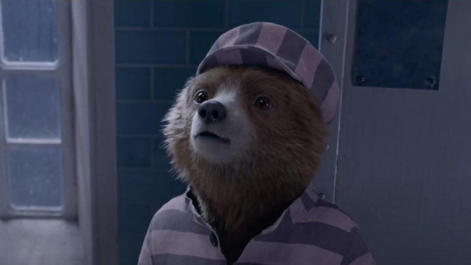 Paddington looking up in his prison uniform in Paddington 2.