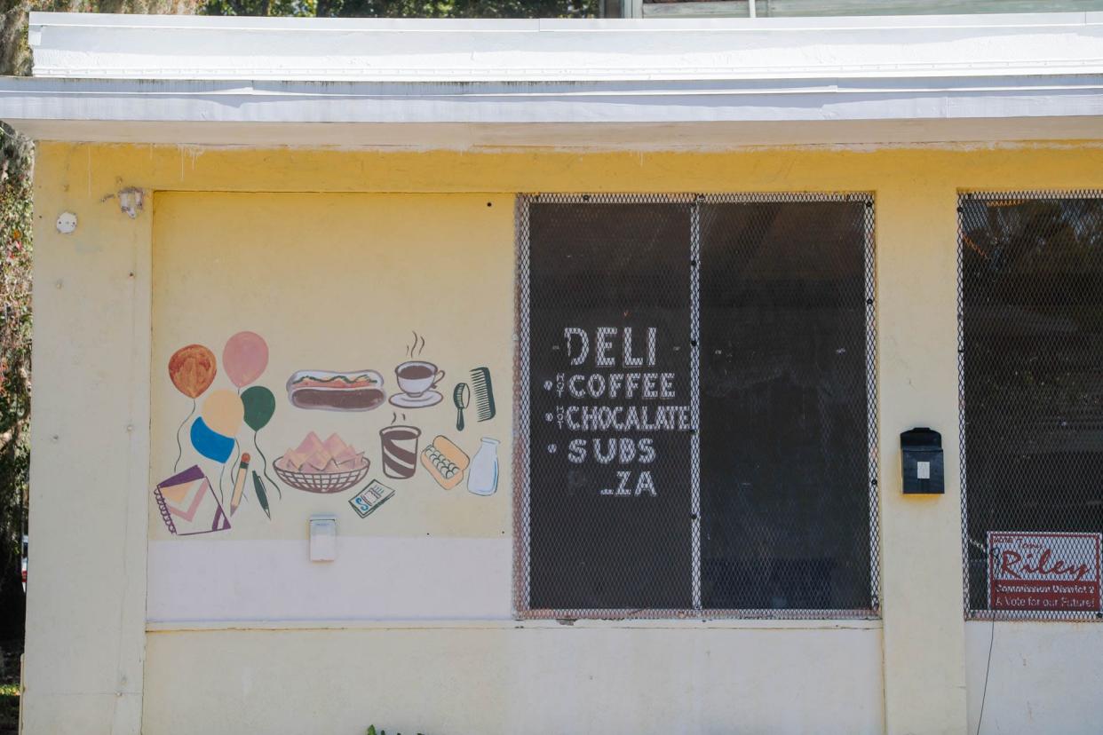 Hand painted drawings for a former deli and convenience store on Waters Avenue.