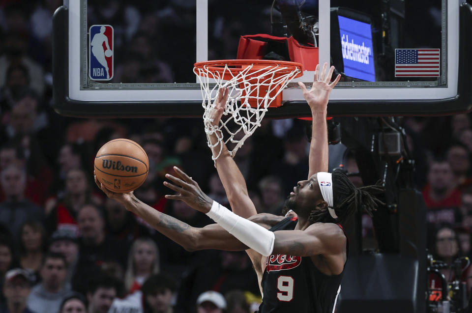 Portland Trail Blazers forward Jerami Grant drives to the basket against the San Antonio Spurs during the second half of an NBA basketball game Friday, Dec. 29, 2023, in Portland, Ore. (AP Photo/Howard Lao)