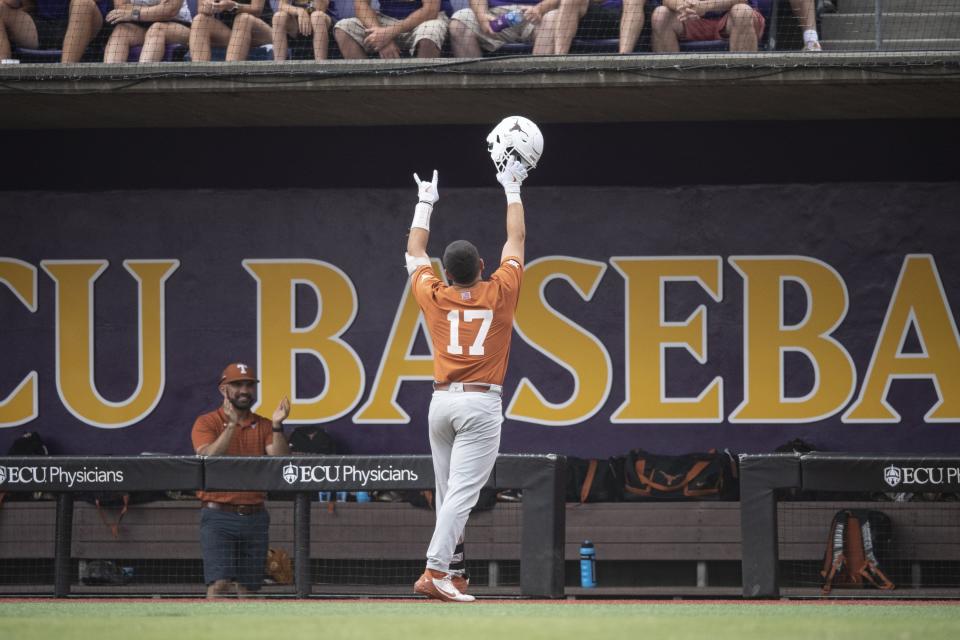 UT slugger Ivan Melendez gestures to the crowd after his three-run homer in the first inning. It was his 32nd homer of the season. In all, seven Texas players hit 10 home runs over the three super regional games in Greenville, N.C. Of the Longhorns' 27 total runs, 16 came from homers.