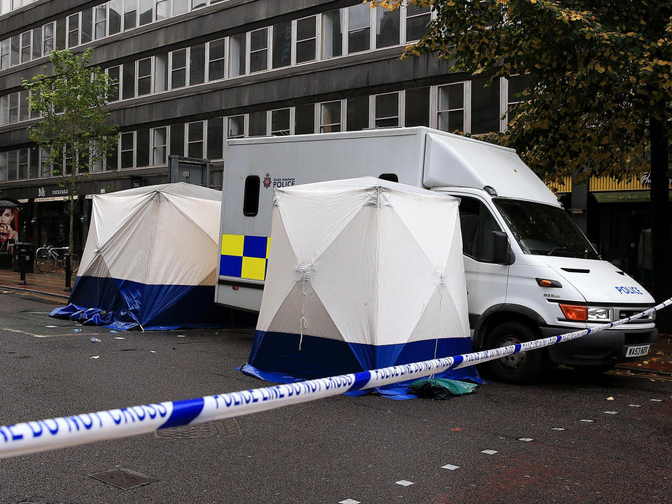 A forensic officer at the scene in Manchester, after a man was stabbed to death in a city centre brawl which left several other people in hospital: PA