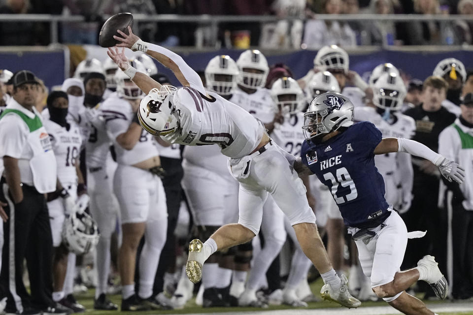 Texas State wide receiver Joey Hobert (10) reaches for a pass next to Rice safety Daveon Hook (29) during the first half of the First Responder Bowl NCAA college football game Tuesday, Dec. 26, 2023, in Dallas. (AP Photo/LM Otero)