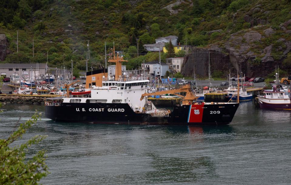 A U.S. Coast Guard ship arrives in the harbor of St. John's, Newfoundland, on Wednesday, June 28, 2023, following the arrival of the ship Horizon Arctic carrying debris from the Titan submersible. The submersible owned by OceanGate Expeditions imploded on its way to the wreck of the Titanic. (Paul Daly/The Canadian Press via AP)