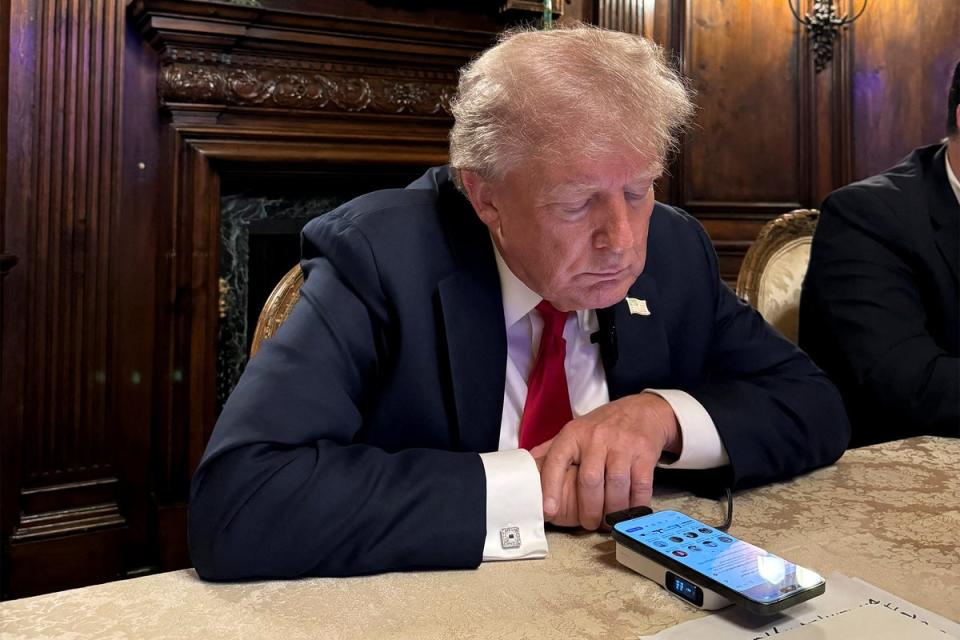 Donald Trump is pictured participating in a live Twitter Spaces interview with CEO Elon Musk (Margo Martin/X/Reuters)