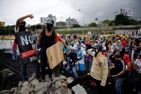 Demonstrators gather in front of an Air Force base while rallying against Venezuelan President Nicolas Maduro's government in Caracas, Venezuela, June 24, 2017. REUTERS/Ivan Alvarado