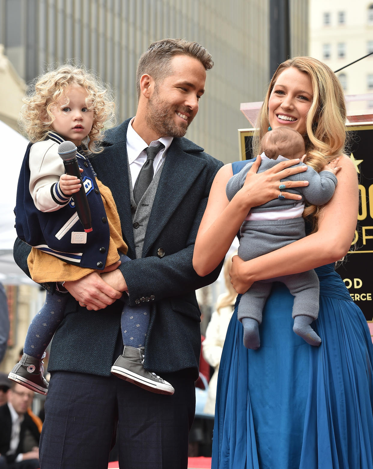 Ryan Reynolds holding daughter James Reynolds while Blake Lively holds daughter Ines Reynolds at his Hollywood Walk Of Fame star ceremony