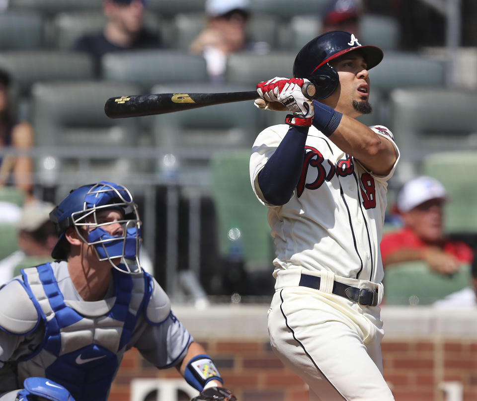 Atlanta Braves' Rafael Ortega, right, watches his grand slam against he Los Angeles Dodgers during the sixth inning of a baseball game Sunday, Aug. 18, 2019, in Atlanta. (Curtis Compton/Atlanta Journal-Constitution via AP)