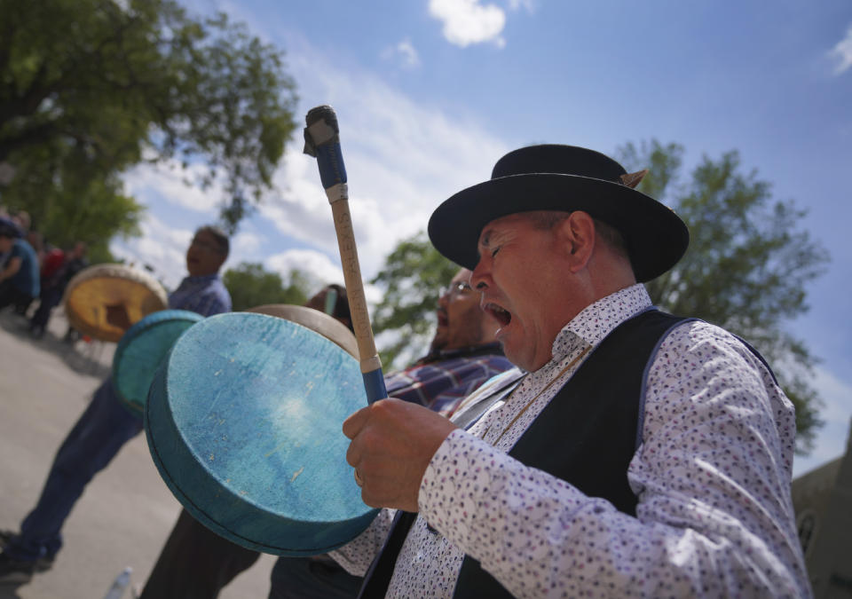 Eugene Alexis plays the drum at the conclusion of the rededication ceremony for Sacred Heart Church of the First Peoples on Sunday, July 17, 2022, in Edmonton, Alberta. In 2020, the church was damaged in a large fire and has now been renovated ahead of Pope Francis' visit to the Canadian province. (AP Photo/Jessie Wardarski)