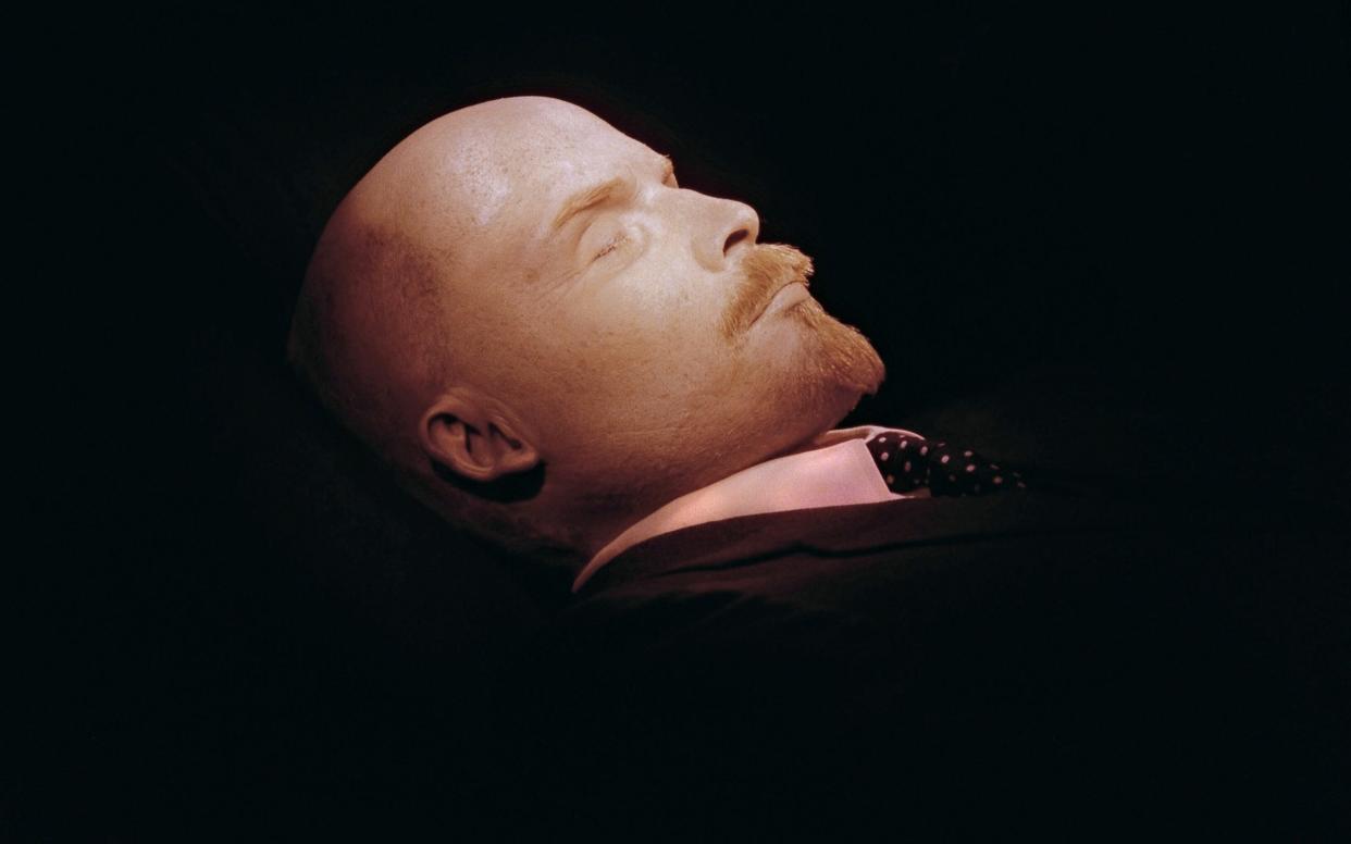 Vladimir Lenin's body lies in its glass sarcophagus on Red Square. - AFP