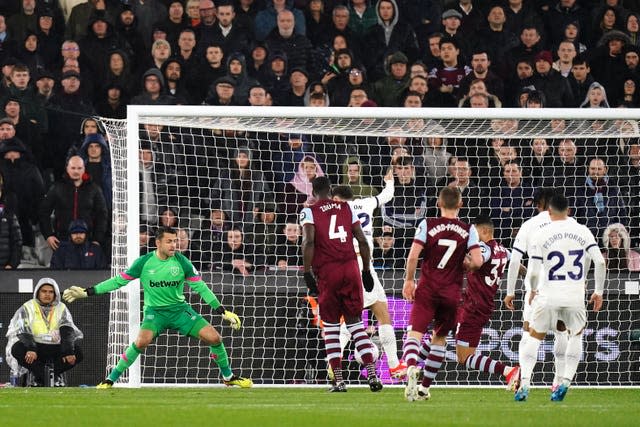 Brennan Johnson, obscured, scores Tottenham’s goal against West Ham